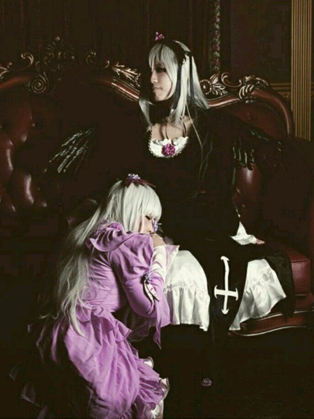 1girl dress frills long_hair long_sleeves multiple_cosplay silver_hair sitting suigintou tagme very_long_hair