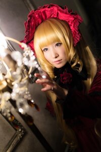 Rating: Safe Score: 0 Tags: 1girl blonde_hair blue_eyes blurry bonnet depth_of_field dress drill_hair flower lips long_hair looking_at_viewer photo red_flower red_rose rose shinku solo User: admin