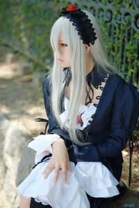 Rating: Safe Score: 0 Tags: 1girl blurry blurry_background depth_of_field dress flower frills gothic_lolita hairband lips lolita_fashion long_hair long_sleeves outdoors red_eyes solo suigintou User: admin