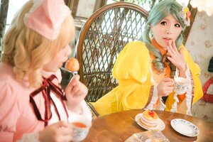 Rating: Safe Score: 0 Tags: 2girls blonde_hair blurry blurry_foreground cake cup depth_of_field dress drill_hair dutch_angle eating fence flower food fork hair_ornament indoors multiple_cosplay multiple_girls pastry plate sitting spoon table tagme tea teacup tiered_tray window User: admin