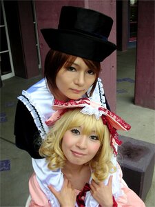 Rating: Safe Score: 0 Tags: 2girls blonde_hair brown_hair hat lips looking_at_viewer multiple_cosplay multiple_girls photo realistic short_hair smile tagme top_hat User: admin