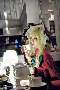 Rating: Safe Score: 0 Tags: 1girl blonde_hair blurry cup hat long_hair mob_cap ribbon shinku sitting solo User: admin