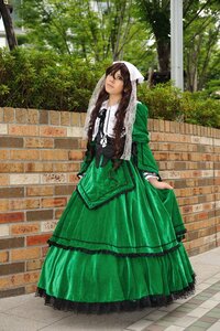 Rating: Safe Score: 0 Tags: 1girl brown_hair checkered_floor dress green_dress long_hair outdoors solo standing suiseiseki tree User: admin