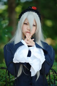 Rating: Safe Score: 0 Tags: 1girl blurry blurry_background depth_of_field dress flower hair_between_eyes hairband lips long_hair long_sleeves looking_at_viewer red_eyes solo suigintou User: admin