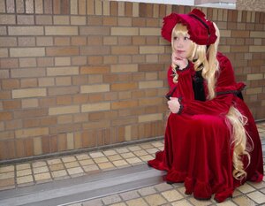 Rating: Safe Score: 0 Tags: 1girl blonde_hair blue_eyes bonnet brick_wall dress long_hair long_sleeves red_dress rose shinku sitting solo tile_floor tiles User: admin