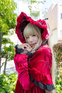 Rating: Safe Score: 0 Tags: 1girl bangs blonde_hair blue_eyes blurry bonnet bush day depth_of_field dress flower lace long_sleeves looking_at_viewer outdoors red_dress shinku solo umbrella User: admin