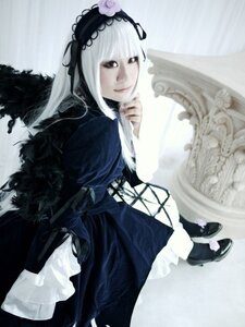 Rating: Safe Score: 0 Tags: 1girl closed_mouth dress frills gothic_lolita hairband lolita_fashion long_hair long_sleeves looking_at_viewer ribbon silver_hair sitting solo suigintou wings User: admin