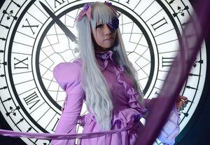 Rating: Safe Score: 0 Tags: 1girl barasuishou bow clock dress eyepatch frills long_hair long_sleeves silver_hair solo stained_glass window User: admin