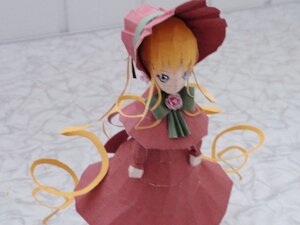 Rating: Safe Score: 0 Tags: 1girl blonde_hair blue_eyes bonnet bow bowtie capelet doll dress green_bow long_hair long_sleeves looking_at_viewer photo red_dress rose shinku solo standing User: admin