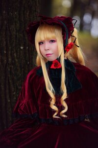 Rating: Safe Score: 0 Tags: 1girl bangs blonde_hair blue_eyes blurry blurry_background bonnet bow capelet dress flower lips long_hair looking_at_viewer red_dress red_flower red_rose rose shinku solo User: admin