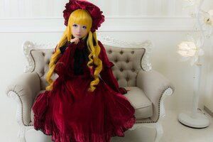 Rating: Safe Score: 0 Tags: 1girl bangs blonde_hair blue_eyes bonnet bow dress flower long_hair looking_at_viewer red_dress rose shinku sitting solo User: admin