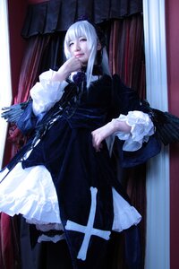 Rating: Safe Score: 0 Tags: 1girl bangs black_dress closed_eyes curtains dress frills gothic_lolita indoors lolita_fashion long_hair long_sleeves sitting solo standing suigintou white_hair window wings User: admin