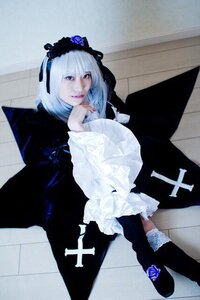 Rating: Safe Score: 0 Tags: 1girl black_dress dress flower frills gothic_lolita hairband lolita_fashion long_sleeves looking_at_viewer rose sitting solo suigintou User: admin