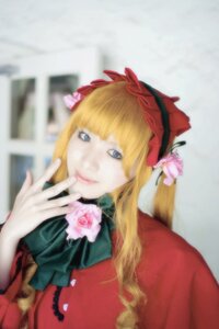 Rating: Safe Score: 0 Tags: 1girl bangs blonde_hair blue_eyes blurry blurry_background bow depth_of_field dress flower lips long_hair looking_at_viewer photo pink_flower pink_rose red_dress rose shinku solo upper_body User: admin