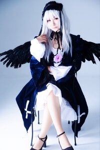 Rating: Safe Score: 0 Tags: 1girl black_wings dress feathers flower frills hairband high_heels long_hair long_sleeves looking_at_viewer rose silver_hair sitting solo suigintou wings User: admin