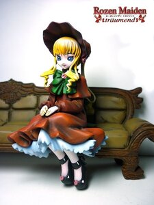 Rating: Safe Score: 0 Tags: 1girl blonde_hair blue_eyes bonnet bow bowtie capelet doll dress full_body green_bow green_neckwear hat long_hair long_sleeves looking_at_viewer red_dress shinku shoes sidelocks sitting solo User: admin