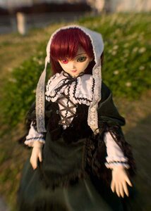 Rating: Safe Score: 0 Tags: 1girl black_dress blurry corset depth_of_field doll dress frills gothic_lolita green_eyes heterochromia long_sleeves looking_at_viewer outdoors red_eyes solo suiseiseki User: admin