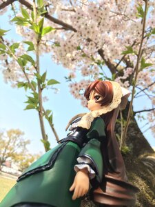 Rating: Safe Score: 0 Tags: 1girl blue_sky blurry blurry_foreground brown_eyes brown_hair cloud day depth_of_field doll dress flower frills green_dress long_hair long_sleeves outdoors puffy_sleeves sky solo suiseiseki tree very_long_hair User: admin