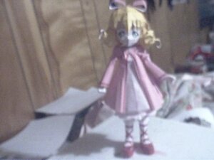 Rating: Safe Score: 0 Tags: 1girl blonde_hair blue_eyes blurry blurry_foreground bow depth_of_field doll hair_bow hinaichigo long_sleeves motion_blur solo standing User: admin