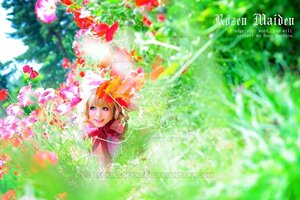 Rating: Safe Score: 0 Tags: 1girl blonde_hair blue_eyes blurry blurry_foreground depth_of_field dress english_text field flower grass hinaichigo medicine_melancholy red_dress smile solo watermark web_address User: admin