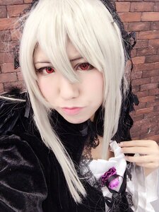 Rating: Safe Score: 0 Tags: 1girl brick_wall closed_mouth hair_between_eyes looking_at_viewer red_eyes smile solo suigintou upper_body white_hair User: admin