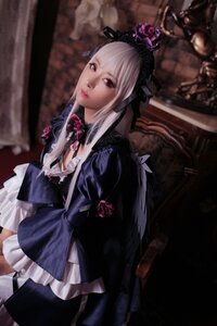 Rating: Safe Score: 0 Tags: 1girl blurry breasts dress flower frills gothic_lolita indoors lips lolita_fashion long_hair looking_at_viewer red_eyes solo suigintou User: admin