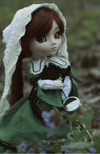 Rating: Safe Score: 0 Tags: 1girl blurry brown_hair depth_of_field doll dress expressionless frills green_dress long_sleeves looking_at_viewer outdoors sitting solo suiseiseki User: admin