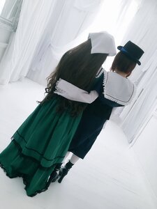 Rating: Safe Score: 0 Tags: 1boy 1girl black_hair black_headwear curtains dress hat indoors long_sleeves multiple_cosplay skirt standing tagme white_shirt User: admin