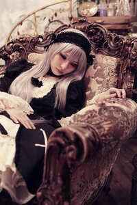 Rating: Safe Score: 0 Tags: 1girl black_dress blurry blurry_background blurry_foreground chair depth_of_field dress frills gothic_lolita hairband half-closed_eyes lace lolita_fashion long_hair long_sleeves sitting solo suigintou User: admin