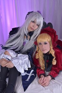 Rating: Safe Score: 0 Tags: 2girls blonde_hair blue_eyes bonnet dress drill_hair frills hat lips long_hair long_sleeves multiple_cosplay multiple_girls shinku silver_hair suigintou tagme User: admin