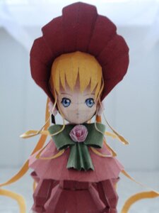 Rating: Safe Score: 0 Tags: 1girl blonde_hair blue_eyes blurry bonnet bow bowtie capelet doll dress green_bow green_neckwear hat long_hair long_sleeves looking_at_viewer photo pink_rose red_dress rose shinku solo standing User: admin