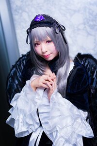 Rating: Safe Score: 0 Tags: 1girl closed_mouth dress feathers flower hairband long_hair long_sleeves looking_at_viewer own_hands_together red_eyes silver_hair smile solo suigintou User: admin