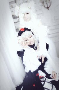 Rating: Safe Score: 0 Tags: 1girl blurry blurry_foreground depth_of_field dress flower frills long_hair multiple_cosplay photo solo suigintou tagme User: admin