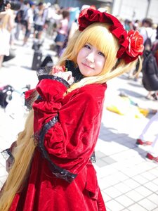 Rating: Safe Score: 0 Tags: 1girl blonde_hair blue_eyes blurry blurry_background blurry_foreground bonnet depth_of_field dress flower hat looking_at_viewer motion_blur photo red_dress shinku solo solo_focus User: admin