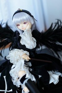 Rating: Safe Score: 0 Tags: 1girl black_wings blurry blurry_foreground depth_of_field doll dress frills hairband lolita_hairband long_hair long_sleeves looking_at_viewer pink_eyes silver_hair smile solo suigintou very_long_hair wings User: admin