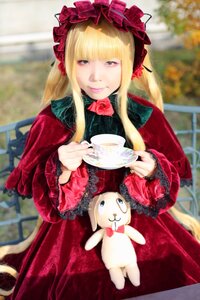 Rating: Safe Score: 0 Tags: 1girl blonde_hair blurry blurry_background bonnet bow chair cup depth_of_field dress flower holding lolita_fashion long_hair looking_at_viewer photo red_dress rose saucer shinku sitting solo stuffed_animal table tea teacup User: admin