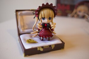 Rating: Safe Score: 0 Tags: 1girl blonde_hair blue_eyes blurry bonnet bow chibi depth_of_field doll dress drill_hair figure frills long_hair long_sleeves photo red_dress shinku sitting solo teacup User: admin