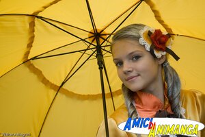 Rating: Safe Score: 0 Tags: 1girl auto_tagged flower hair_flower hair_ornament holding_umbrella kanaria lips looking_at_viewer parasol solo transparent_umbrella umbrella watermark yellow_background User: admin