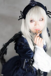 Rating: Safe Score: 0 Tags: 1girl black_ribbon blurry depth_of_field dress frills gothic_lolita hairband lips long_hair long_sleeves looking_at_viewer photo ribbon rose silver_hair solo suigintou wings User: admin