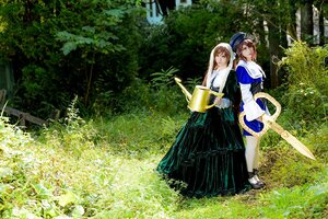 Rating: Safe Score: 0 Tags: 2girls blue_headwear brown_hair closed_eyes day dress hat holding long_hair multiple_cosplay multiple_girls nature outdoors shoes smile standing tagme tree User: admin
