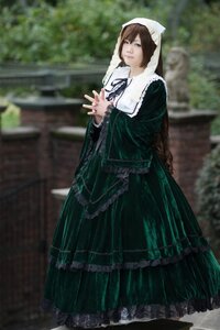 Rating: Safe Score: 0 Tags: 1girl blurry blurry_background brown_hair depth_of_field dress frills green_dress green_eyes long_sleeves looking_at_viewer outdoors own_hands_together solo standing suiseiseki wide_sleeves User: admin