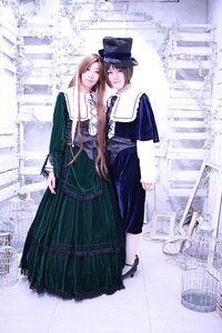 Rating: Safe Score: 0 Tags: 2girls blue_dress brown_hair dress hat long_hair long_sleeves looking_at_viewer multiple_cosplay multiple_girls standing tagme top_hat User: admin