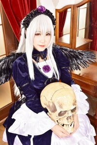 Rating: Safe Score: 0 Tags: 1girl black_wings chair dress frills hairband long_hair long_sleeves looking_at_viewer red_eyes rose silver_hair solo suigintou wings User: admin