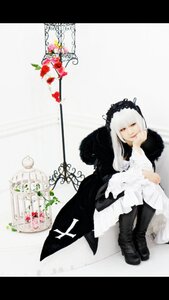 Rating: Safe Score: 0 Tags: 1girl black_footwear boots dress flower gothic_lolita letterboxed lolita_fashion long_hair sitting solo suigintou white_hair User: admin