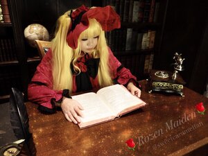 Rating: Safe Score: 0 Tags: 1girl blonde_hair book bow closed_eyes dress long_hair long_sleeves open_book red_dress shinku sitting solo User: admin