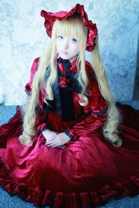 Rating: Safe Score: 0 Tags: 1girl blonde_hair blue_eyes bonnet bow dress flower frills hands_together lips long_hair long_sleeves looking_at_viewer red_dress shinku sitting solo User: admin