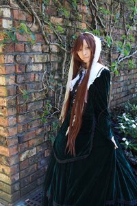 Rating: Safe Score: 0 Tags: 1girl black_dress brick_wall brown_hair coat dress fence green_eyes long_hair looking_at_viewer plant solo standing suiseiseki wall User: admin
