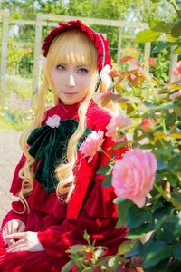 Rating: Safe Score: 0 Tags: 1girl bangs blonde_hair blue_eyes blurry bow depth_of_field dress drill_hair flower long_hair looking_at_viewer pink_flower red_capelet red_dress rose shinku smile solo User: admin