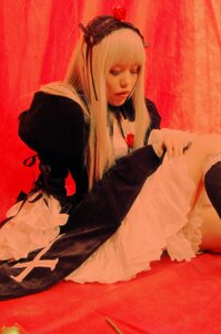 Rating: Safe Score: 0 Tags: 1girl blonde_hair blue_eyes closed_mouth hood lips long_hair long_sleeves necklace sitting solo suigintou User: admin