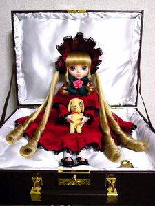 Rating: Safe Score: 0 Tags: 1girl blonde_hair blue_eyes bonnet bow doll dress flower long_hair long_sleeves looking_at_viewer pink_bow red_dress rose shinku sitting solo twintails User: admin